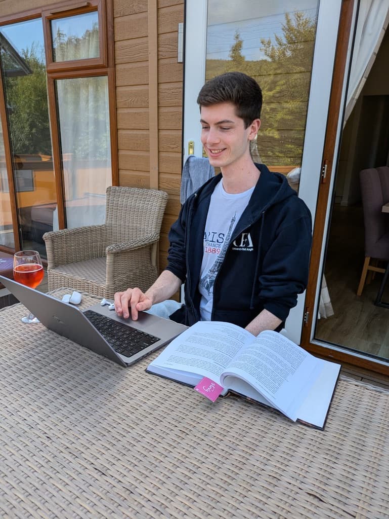 Tom coding on his MacBook