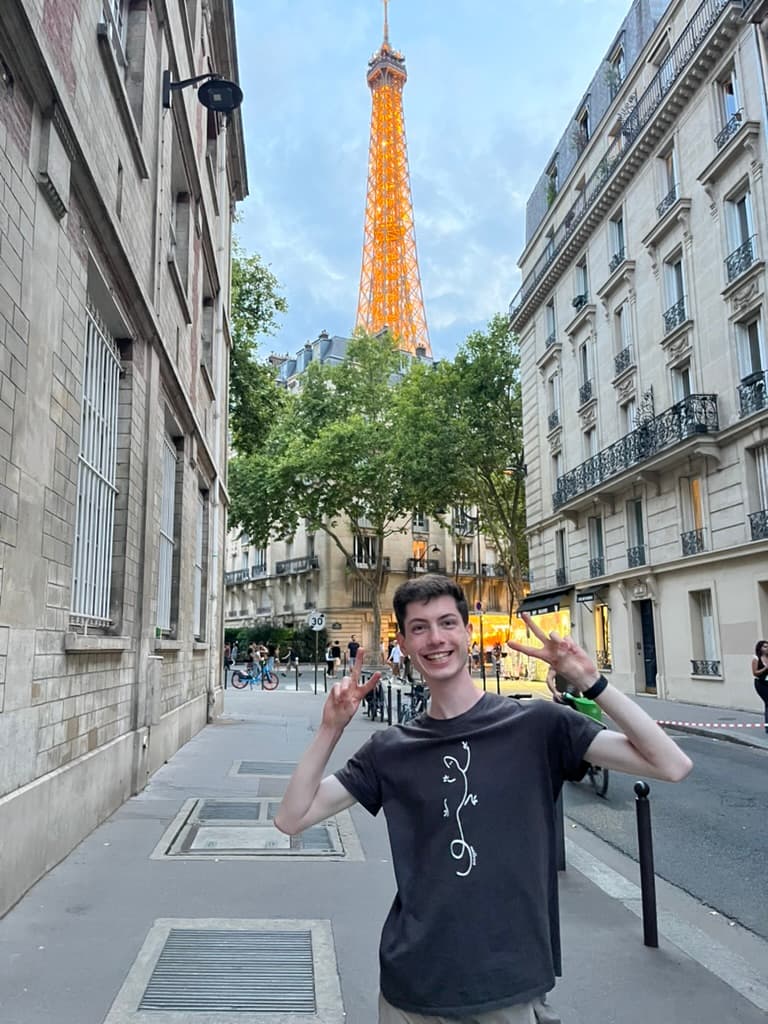 Tom exploring Paris with the Eiffel Tower in the background