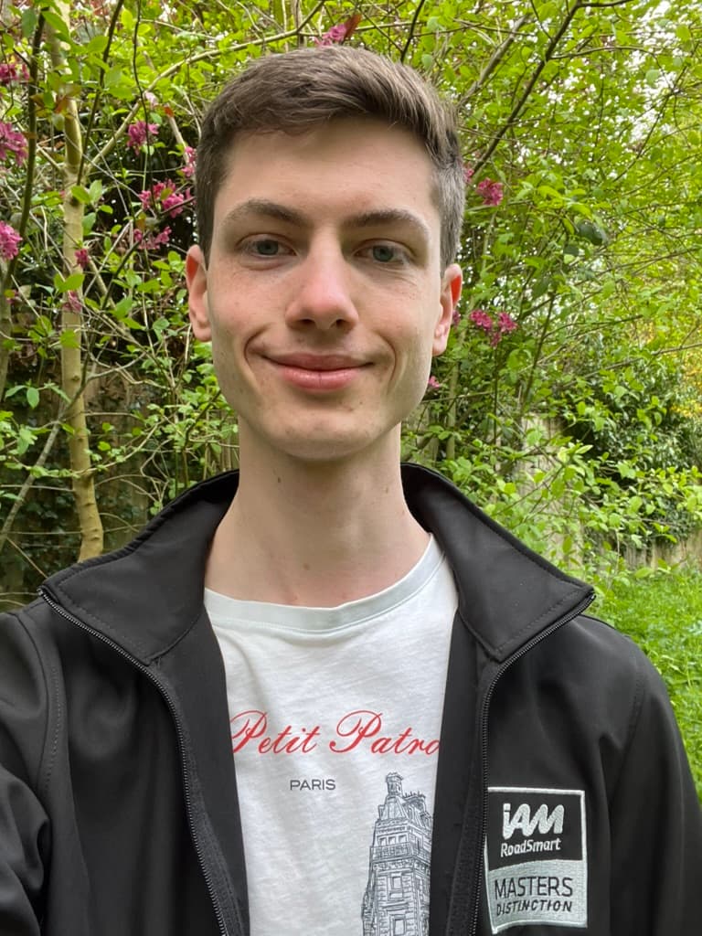 Tom smiling outdoors